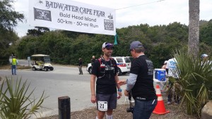 Team NEO athlete Rodney getting his finisher's medal from race director Chris Kostman at the 2016 Badwater Cape Fear