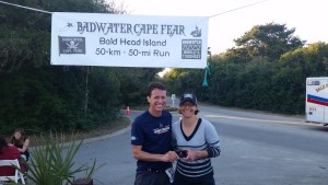 Team NEO athlete Jonathan and Coach Nicole with Jonathan's finisher's buckle at the 2016 Badwater Cape Fear