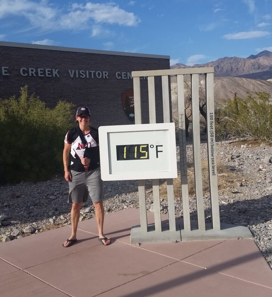 Coach Nicole at the Furnace Creek Visitor Center Thermometer in Death Valley National Park, California