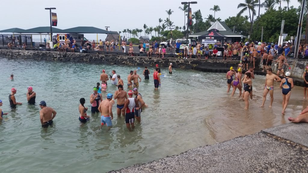 Athletes doing a practice swim at the starting point of IRONMAN World Championships in Kona,.