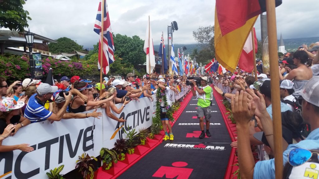 Patrick Lange celebrates with the crowd at the 2016 IRONMAN World Championships after coming in 3rd.