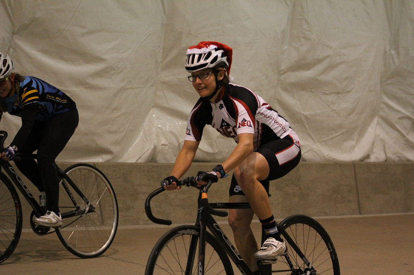 Coach Nicole riding the US Olympic Training Center Velodrome during a Learn the Velodrome course.