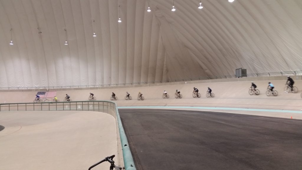 A group riding a paceline at the Learn the Velodrome clinic at the US Olympic Training Center Velodrome in Colorado Springs.