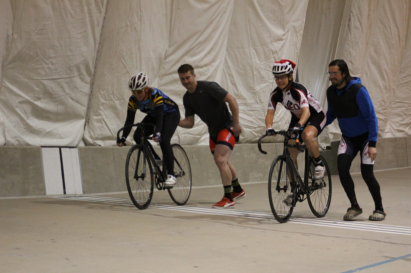 Coach Nicole at the start of a mock match sprint race at the US Olympic Training Center Velodrome during a Learn the Velodrome course.