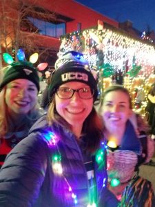 Health Promotion graduate students in front of the UCCS float at the Festival of Lights Parade